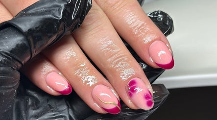 Stylish pink nail art at Venus Studios, Kirkby In Ashfield, England, GB, featuring unique designs.