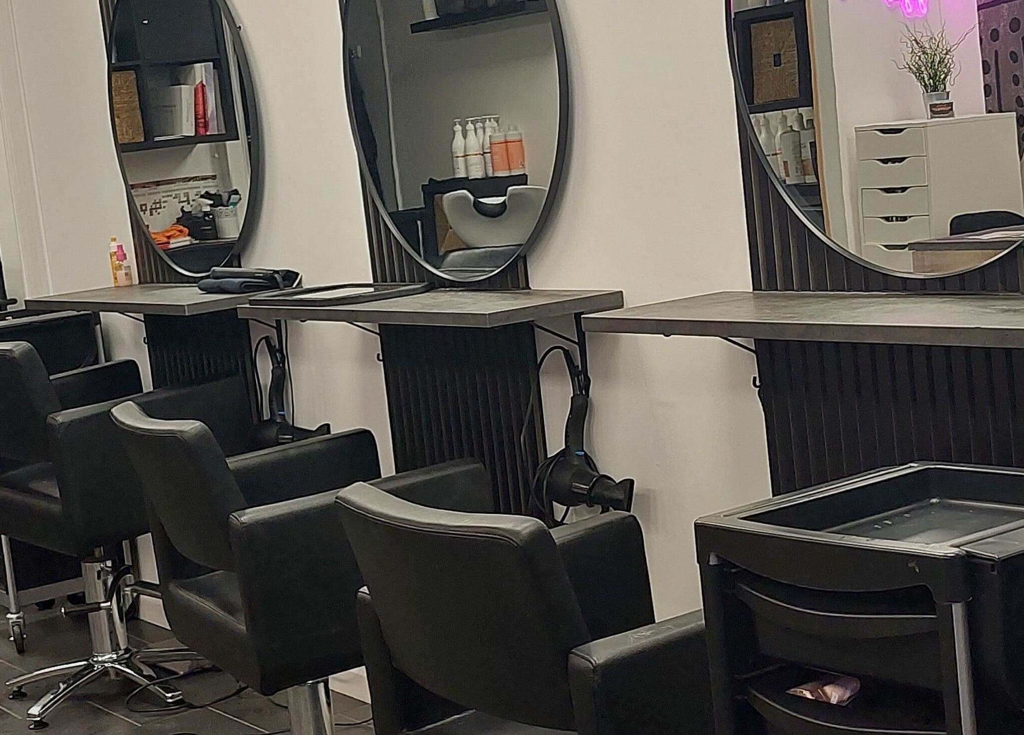 Modern salon chairs and mirrors at Salon19 Coleraine, Coleraine, Northern Ireland, GB offer a luxurious experience.