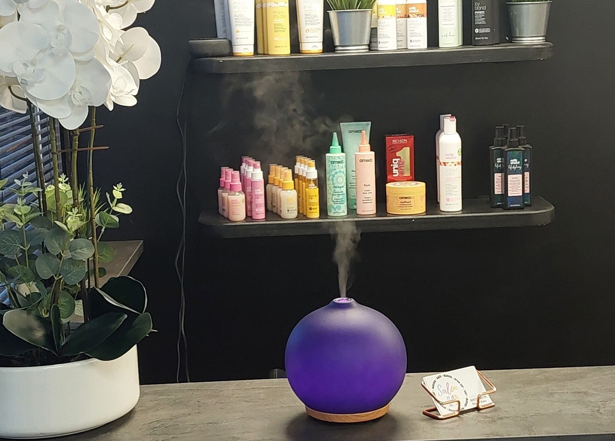 Salon19 Coleraine's product shelf with aroma diffuser in Coleraine, Northern Ireland, GB.