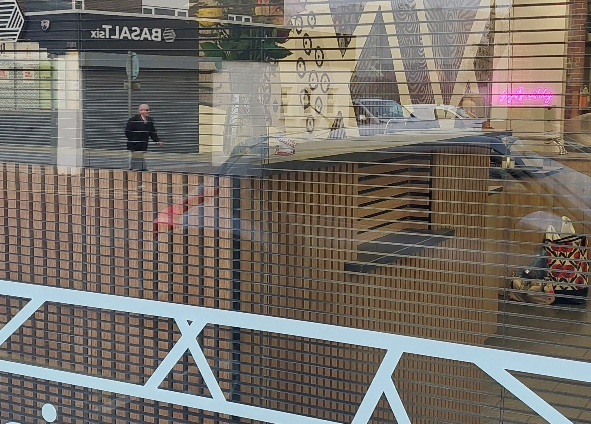 Window reflection at Salon19 Coleraine showcasing interior design, Coleraine, Northern Ireland, GB.