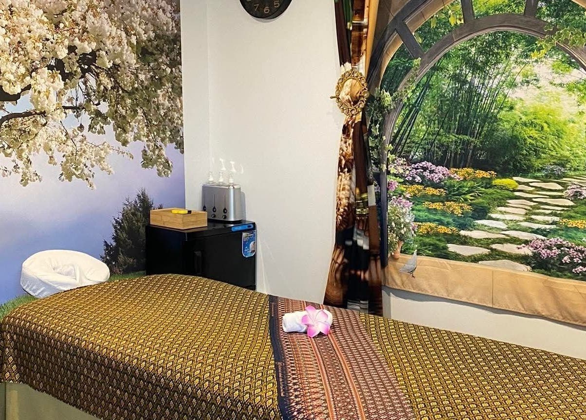 Serene massage room at Sawasdee Massage, Christchurch, Canterbury, NZ, with tranquil nature murals.