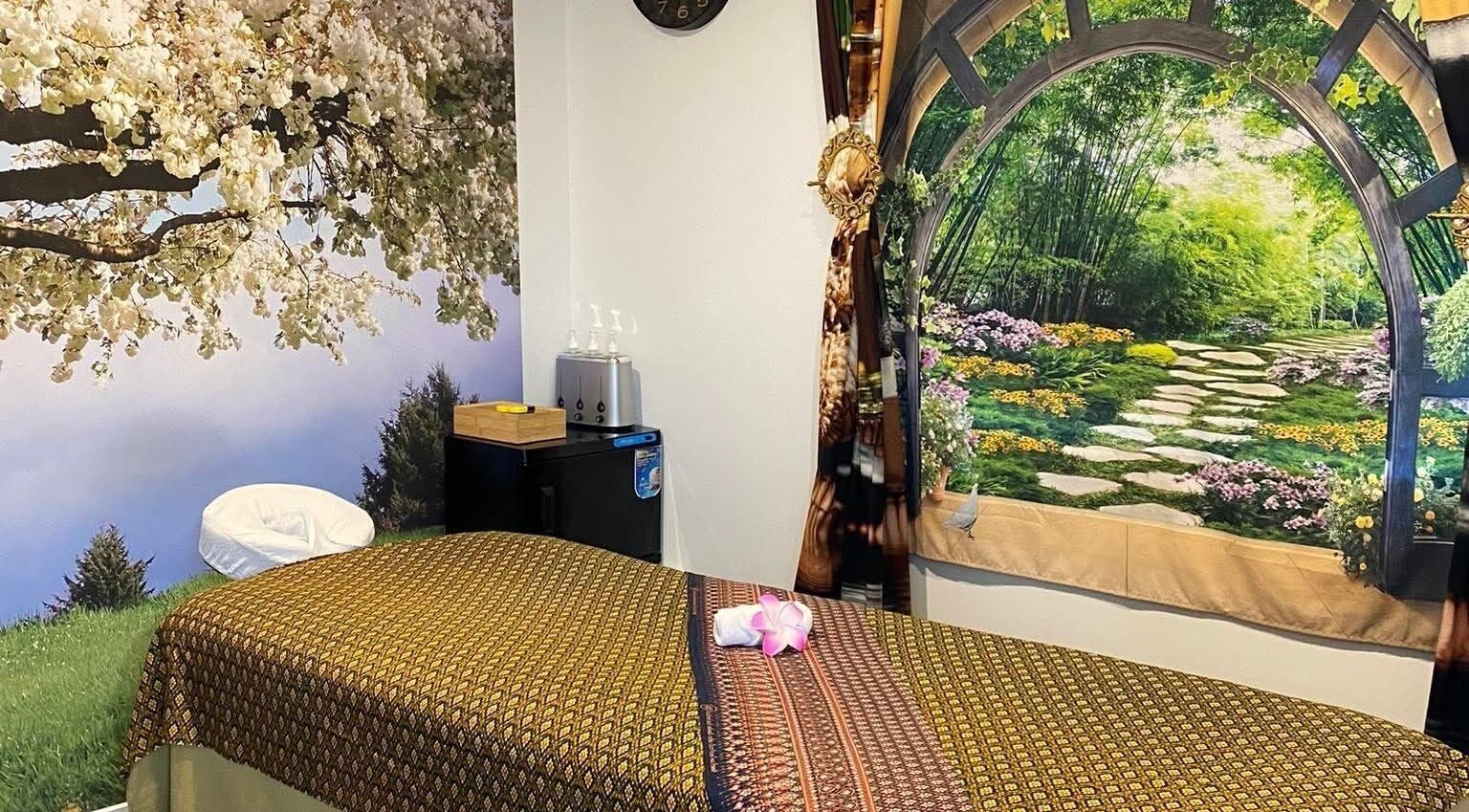 Serene massage room at Sawasdee Massage, Christchurch, Canterbury, NZ, with tranquil nature murals.