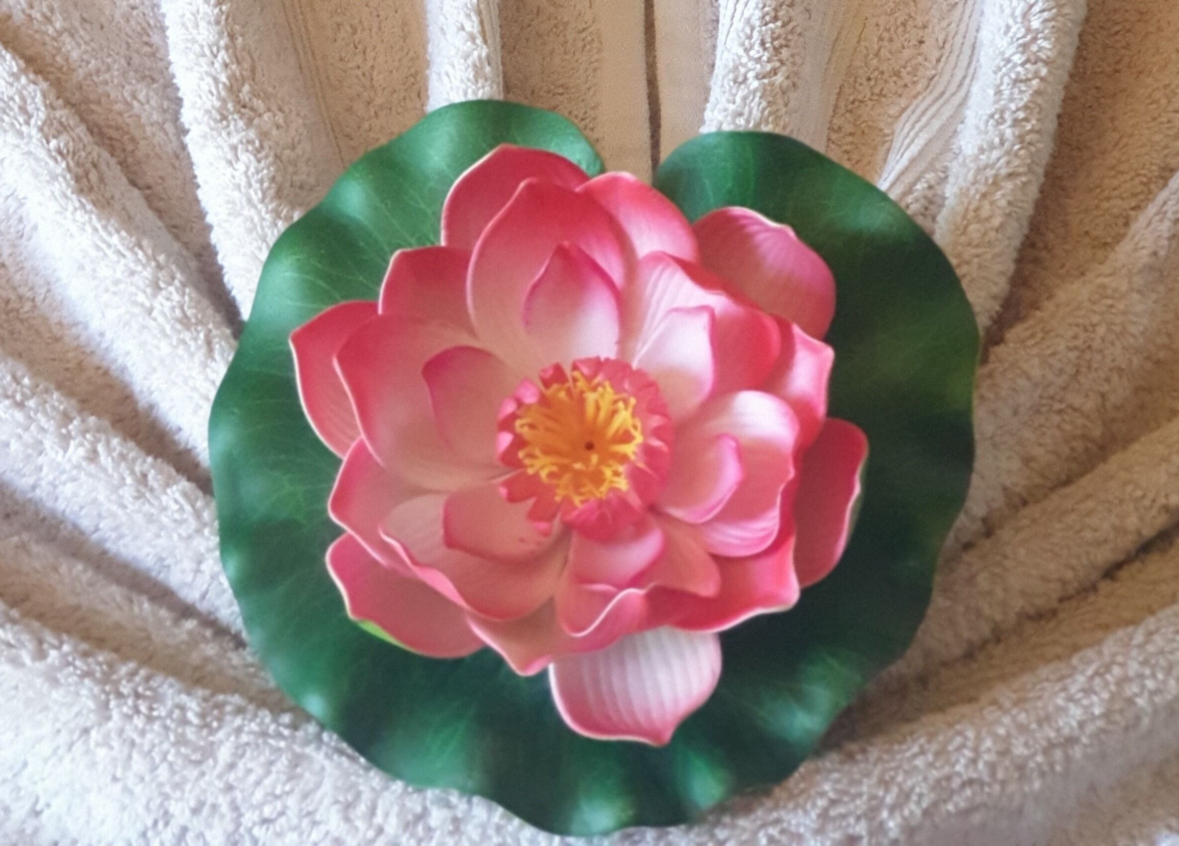 Sawasdee Massage in Christchurch, Canterbury, NZ offers a serene lotus display on a soft towel for relaxation.