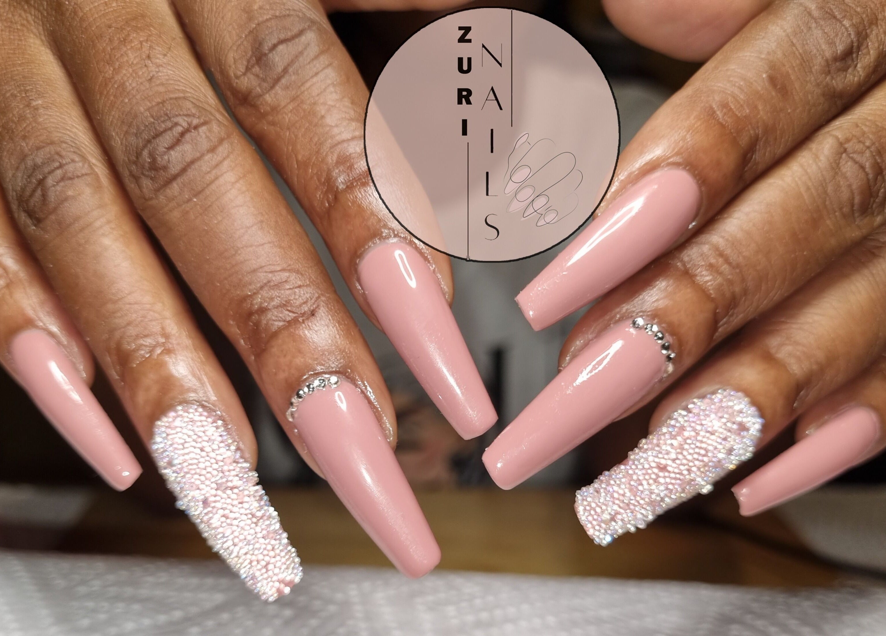 Elegant pink nail design with embellishments at Zuri Nails - Kimberley, Rhodesdene, Northern Cape, ZA.