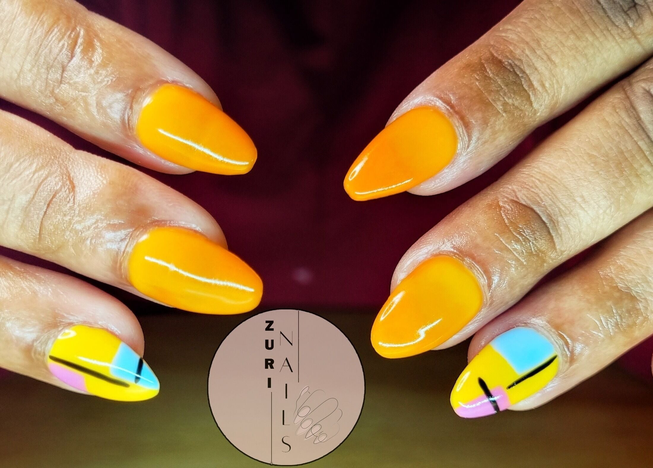 Bright orange nails with unique art at Zuri Nails - Kimberley, Rhodesdene, Northern Cape, ZA.