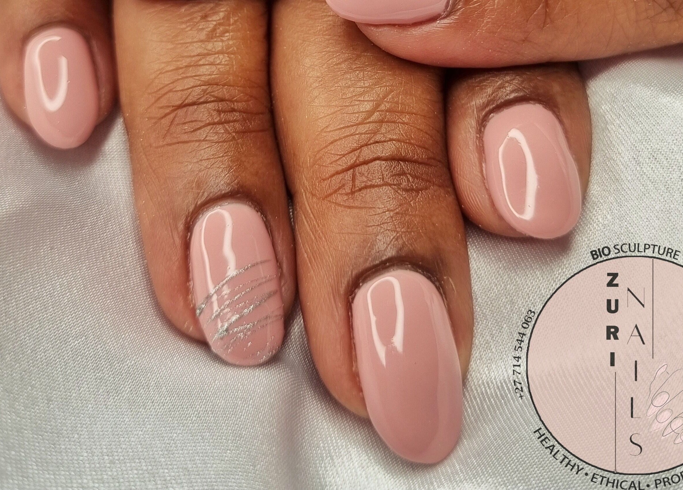Elegant manicure at Zuri Nails - Kimberley in Rhodesdene, Northern Cape, ZA featuring delicate pink nails.