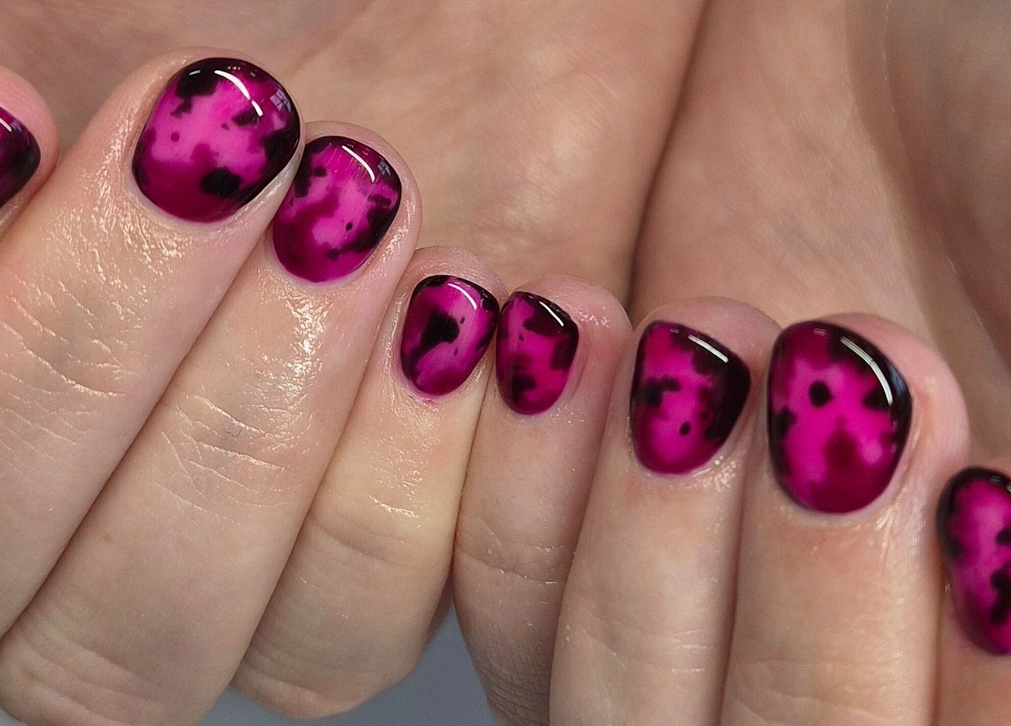 Bright magenta nail art at Art Thou Nails, Manchester, England, GB, showcasing creative design style.