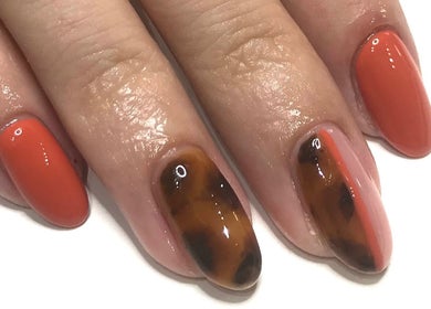 Stylish red and tortoiseshell nail art at I AM Beauty Bedford - Closed Books, Kempston, England, GB.