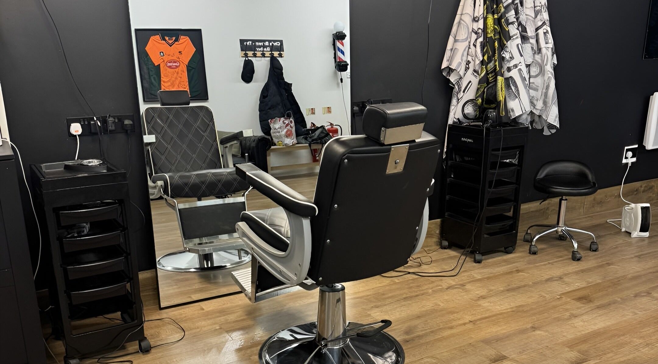 Interior of Chris Brown - The Barber in Plymouth, England, GB, featuring a sleek barber chair and modern decor.
