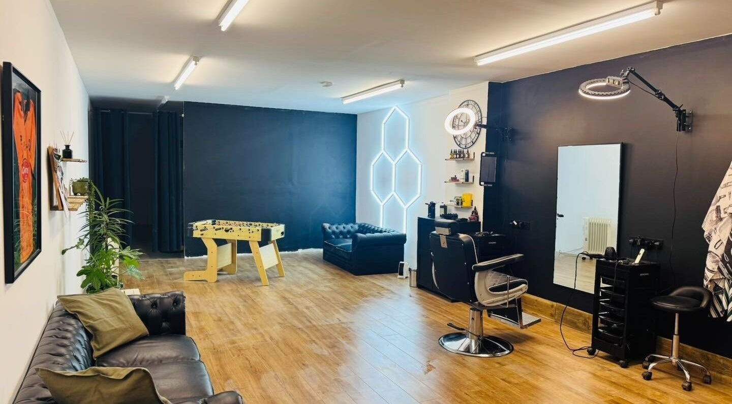 Modern interior of Chris Brown - The Barber in Plymouth, England, GB with leather seating and stylish decor.
