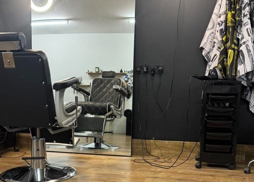 Stylish barber chair at Chris Brown - The Barber in Plymouth, England, GB, showcasing modern interior.