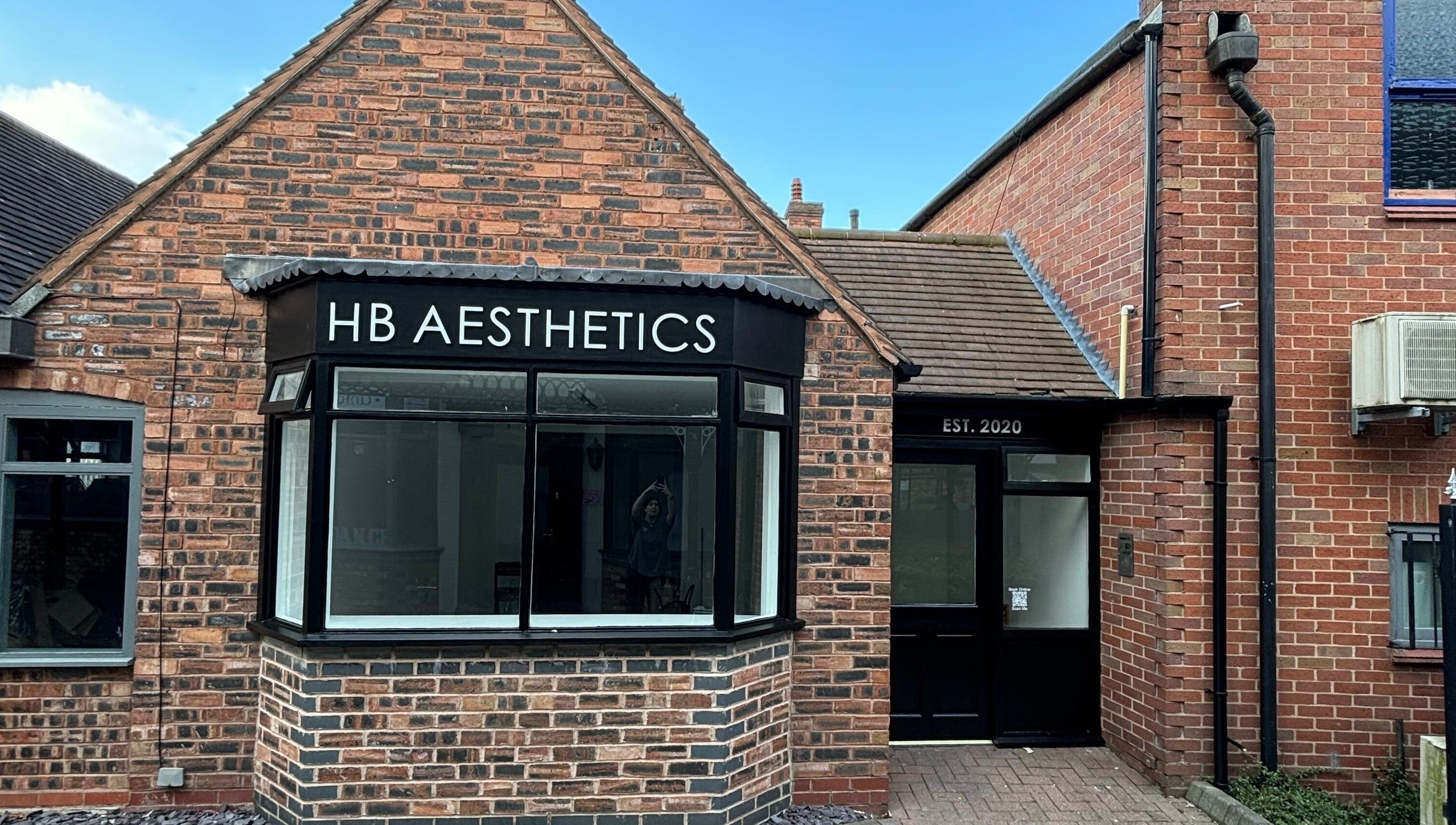 Front view of HB Aesthetics located in Cannock, England, GB, showcasing its inviting brick exterior.