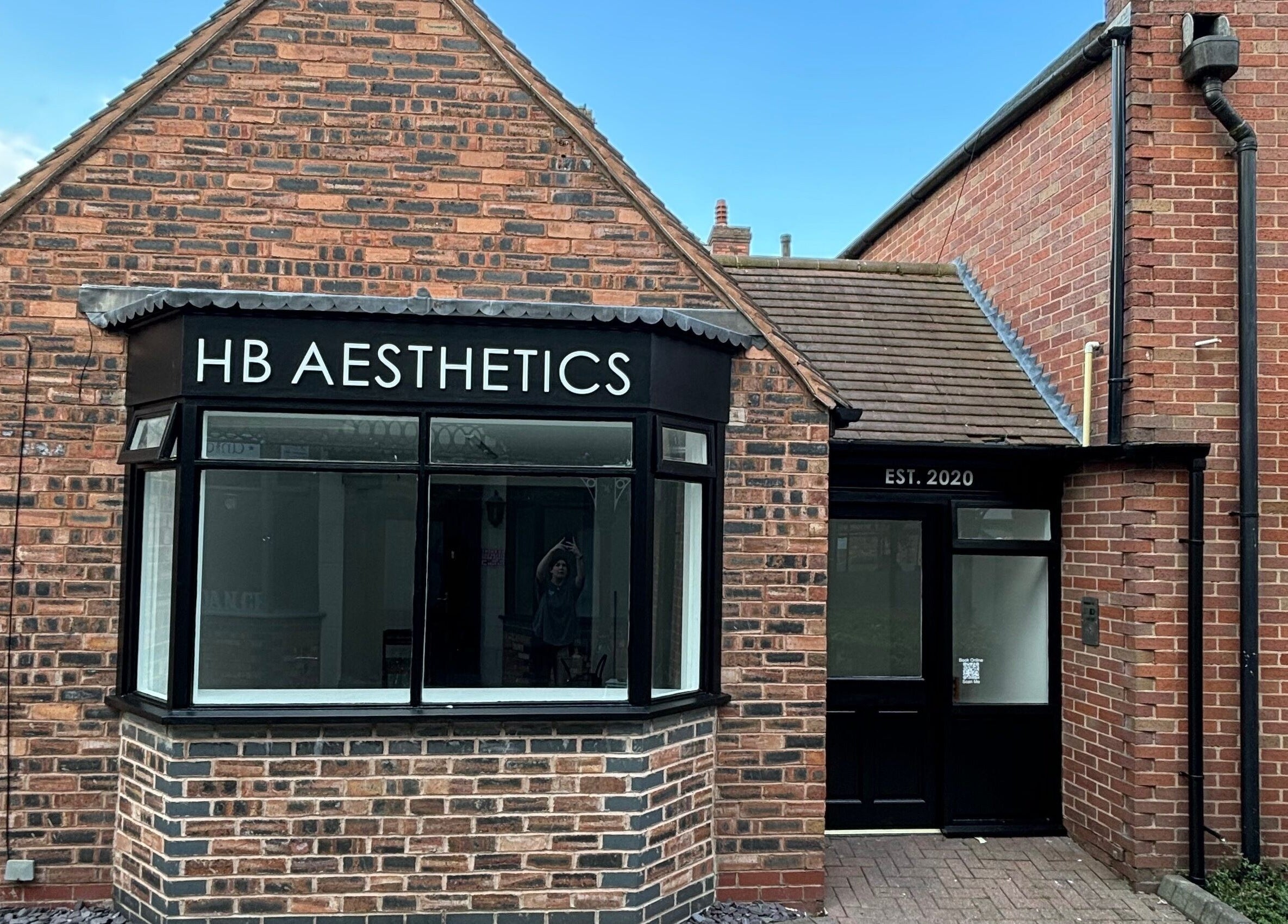 Front view of HB Aesthetics located in Cannock, England, GB, showcasing its inviting brick exterior.