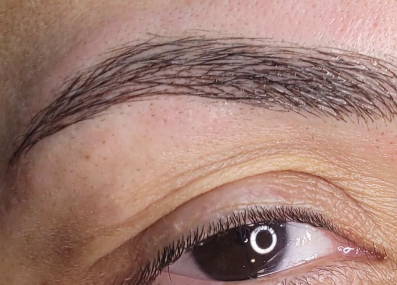 Close-up of expertly shaped brows at INK.SPACE, Ilkeston, England, GB showcasing precise beauty care.