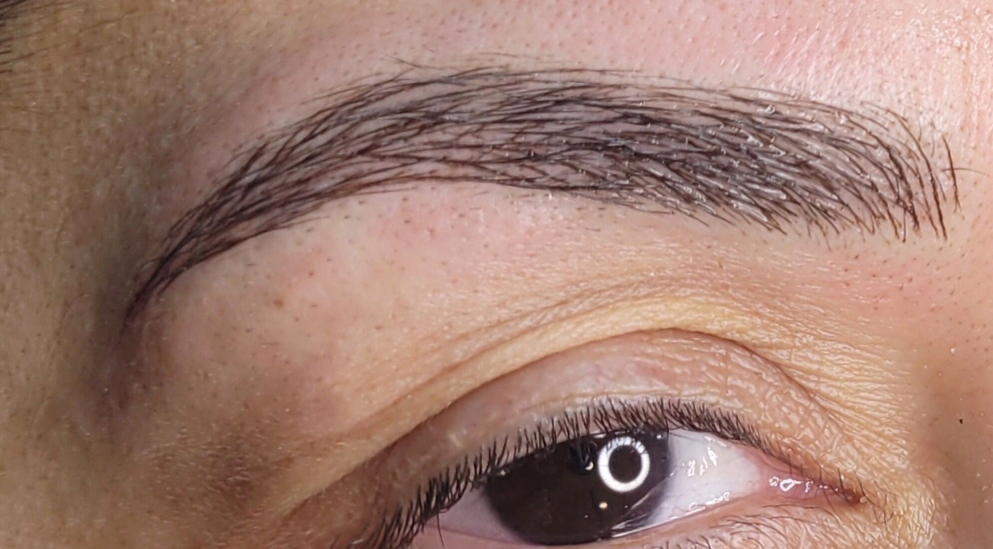 Close-up of expertly shaped brows at INK.SPACE, Ilkeston, England, GB showcasing precise beauty care.