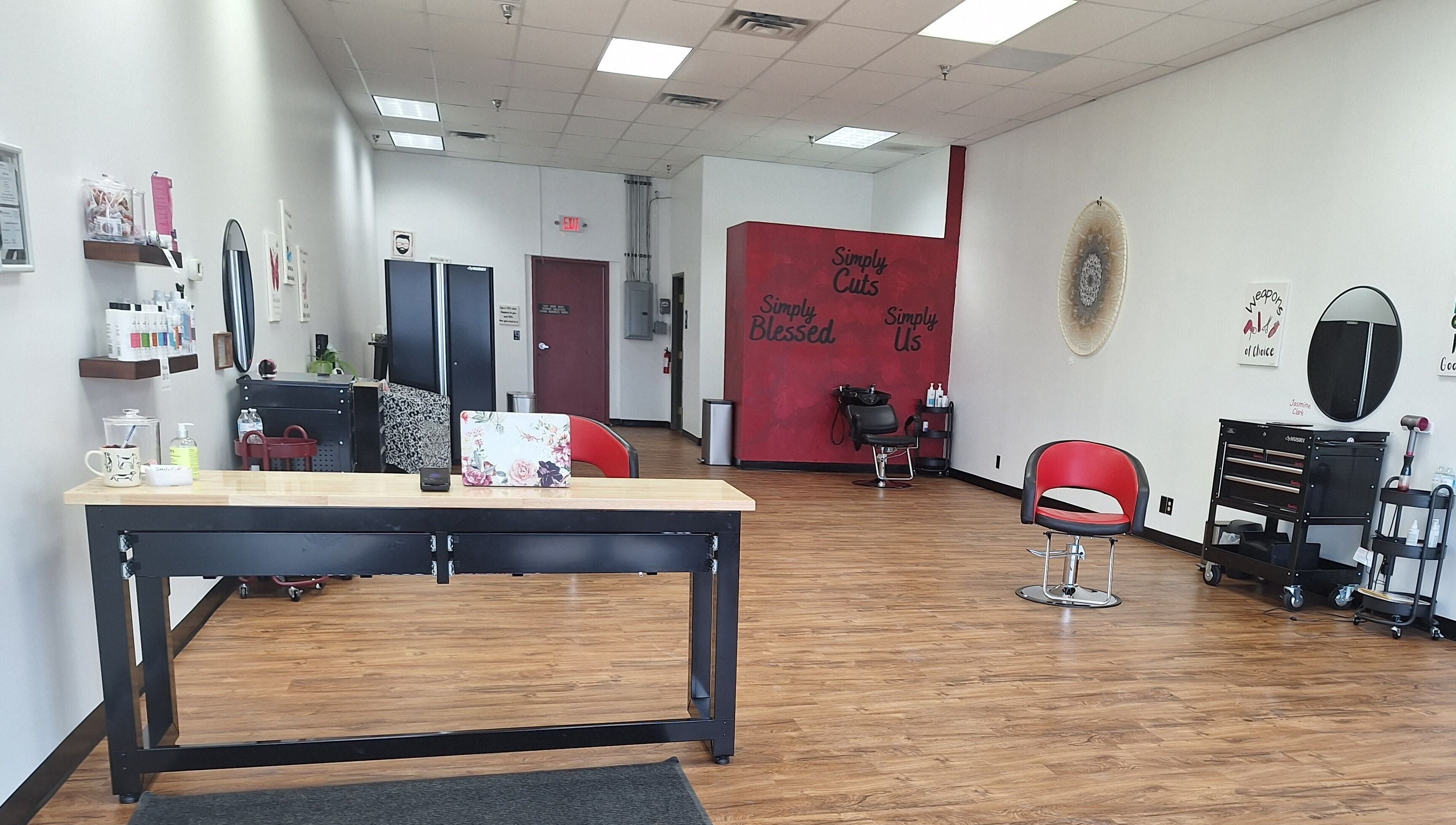 Inside view of Simply Cuts in Forest Lake, Minnesota, US with sleek chairs and modern decor.