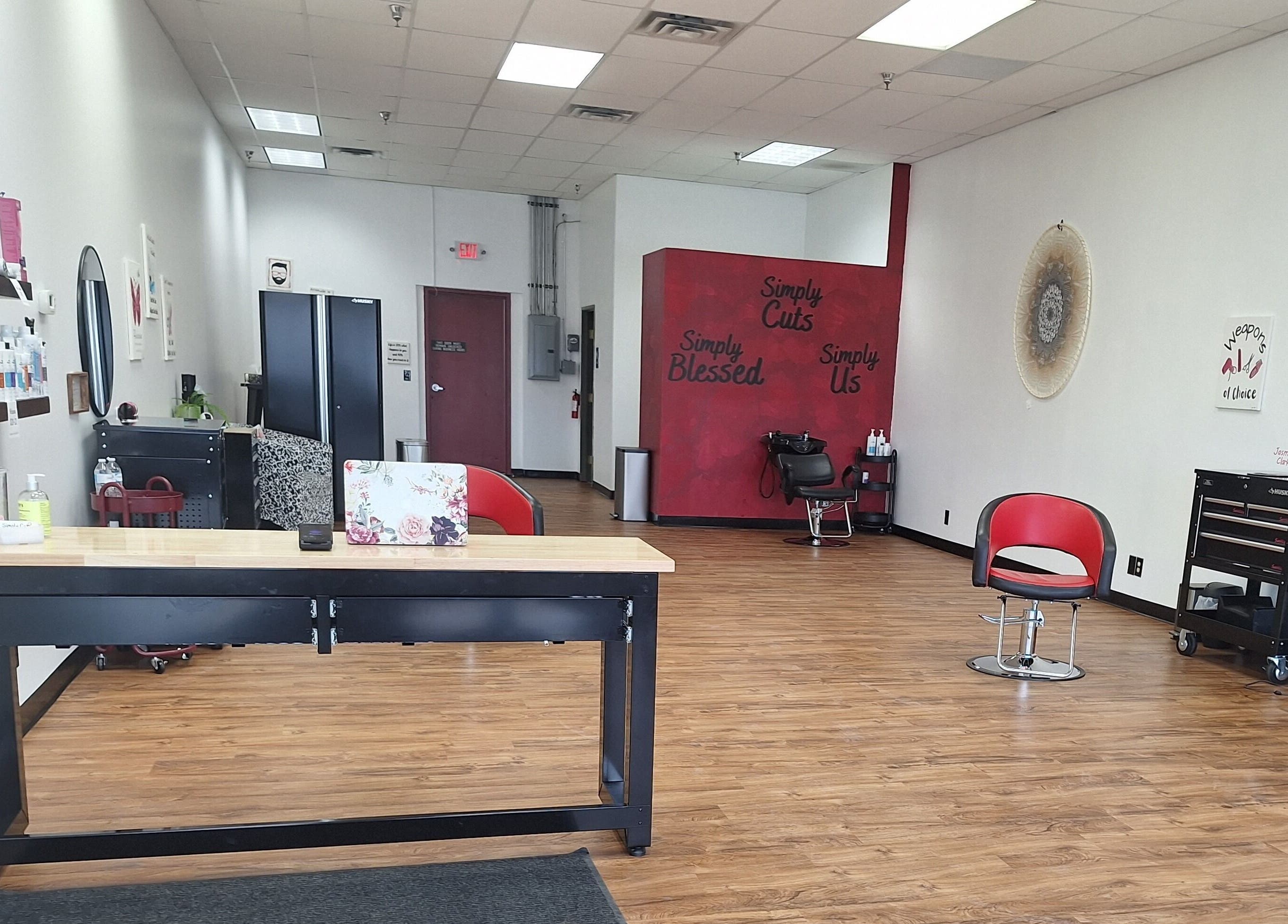 Inside view of Simply Cuts in Forest Lake, Minnesota, US with sleek chairs and modern decor.