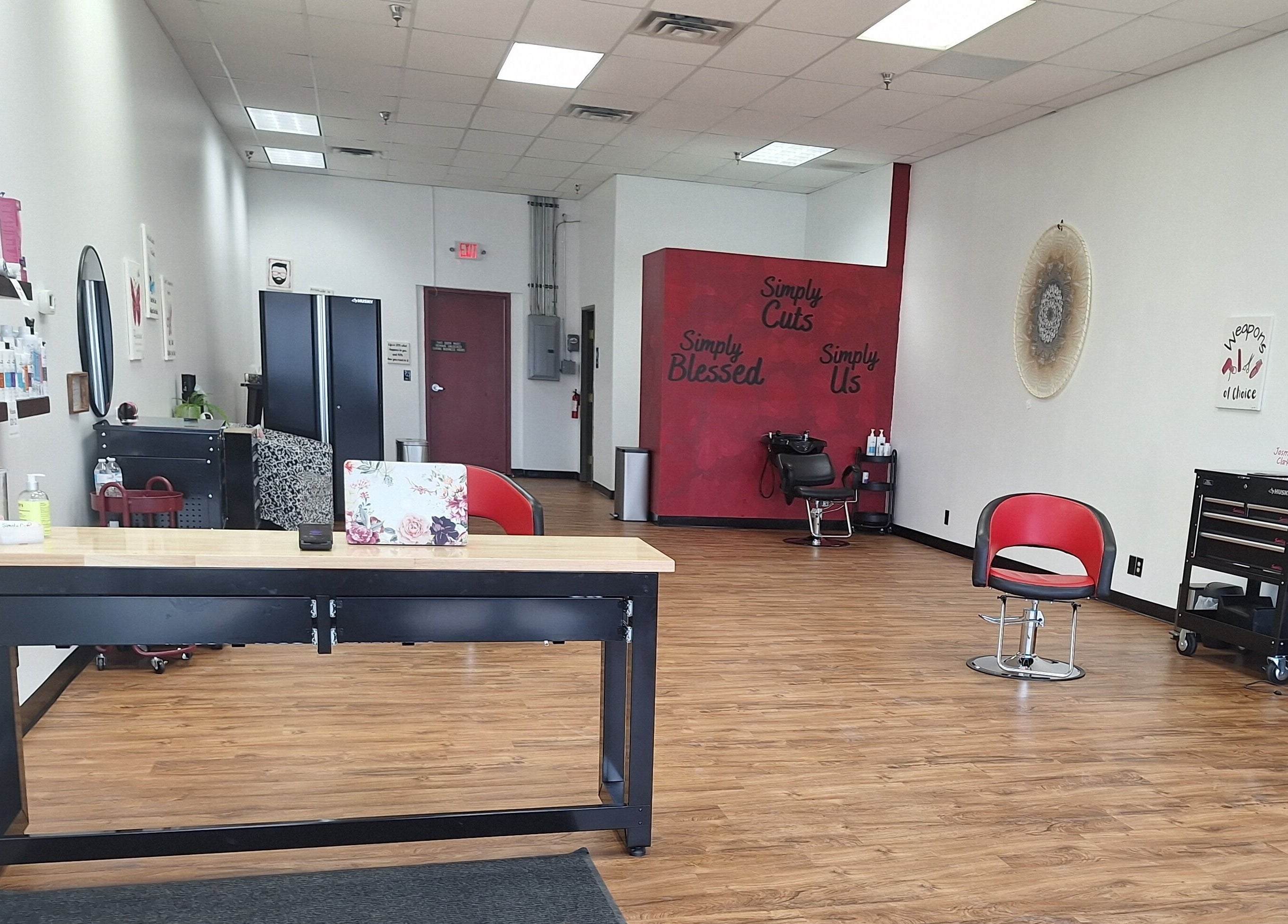 Inside view of Simply Cuts in Forest Lake, Minnesota, US with sleek chairs and modern decor.