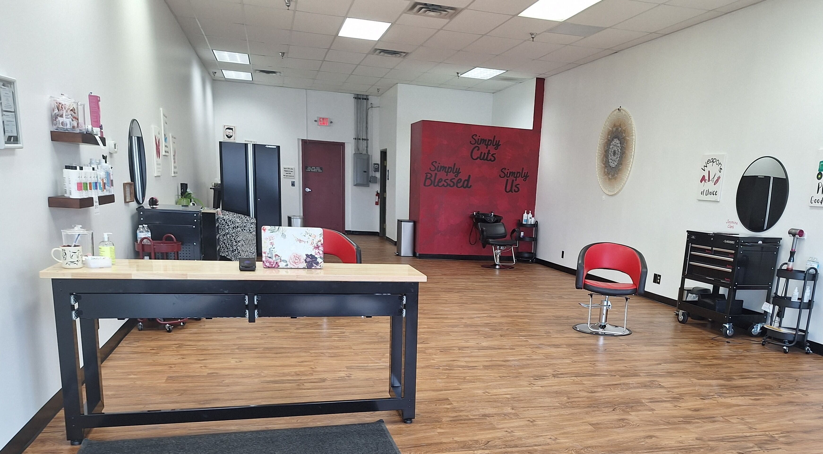Inside view of Simply Cuts in Forest Lake, Minnesota, US with sleek chairs and modern decor.