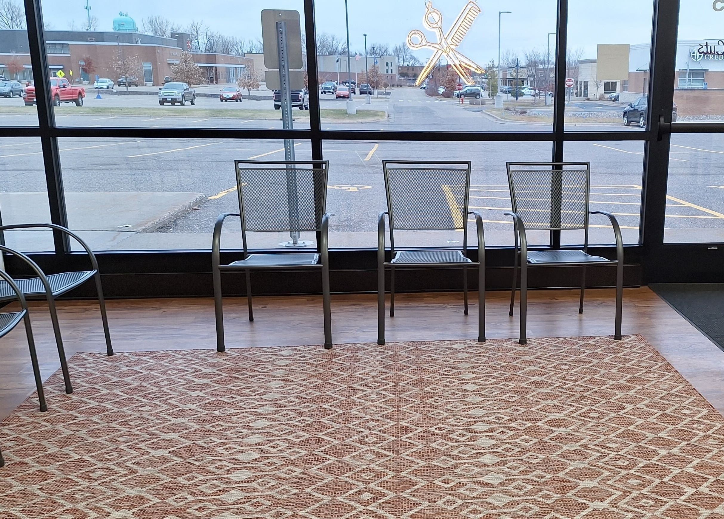 Simply Cuts waiting area with modern chairs in Forest Lake, Minnesota, US.