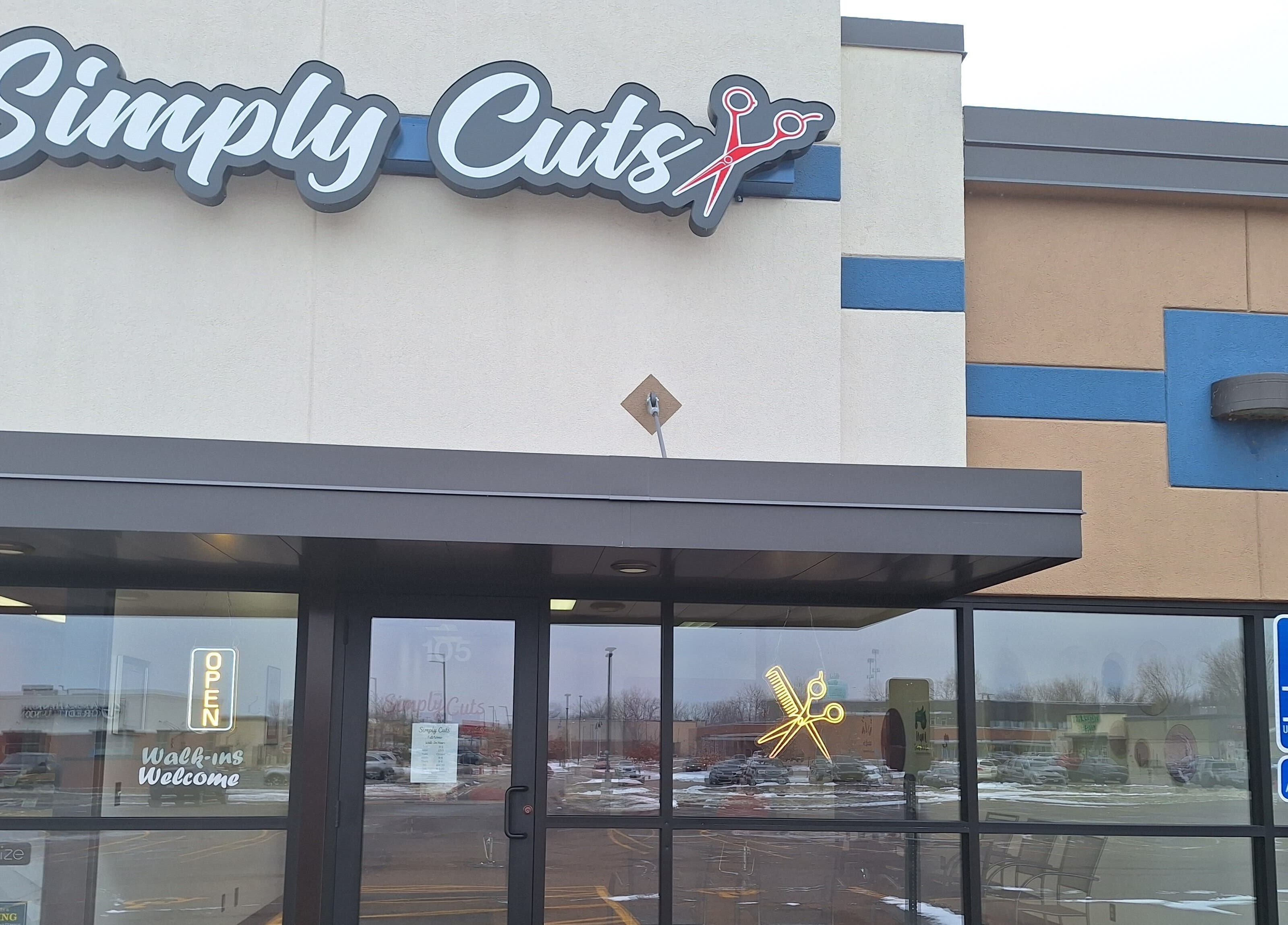 Front view of Simply Cuts salon in Forest Lake, Minnesota, US, showcasing modern entry and logo.