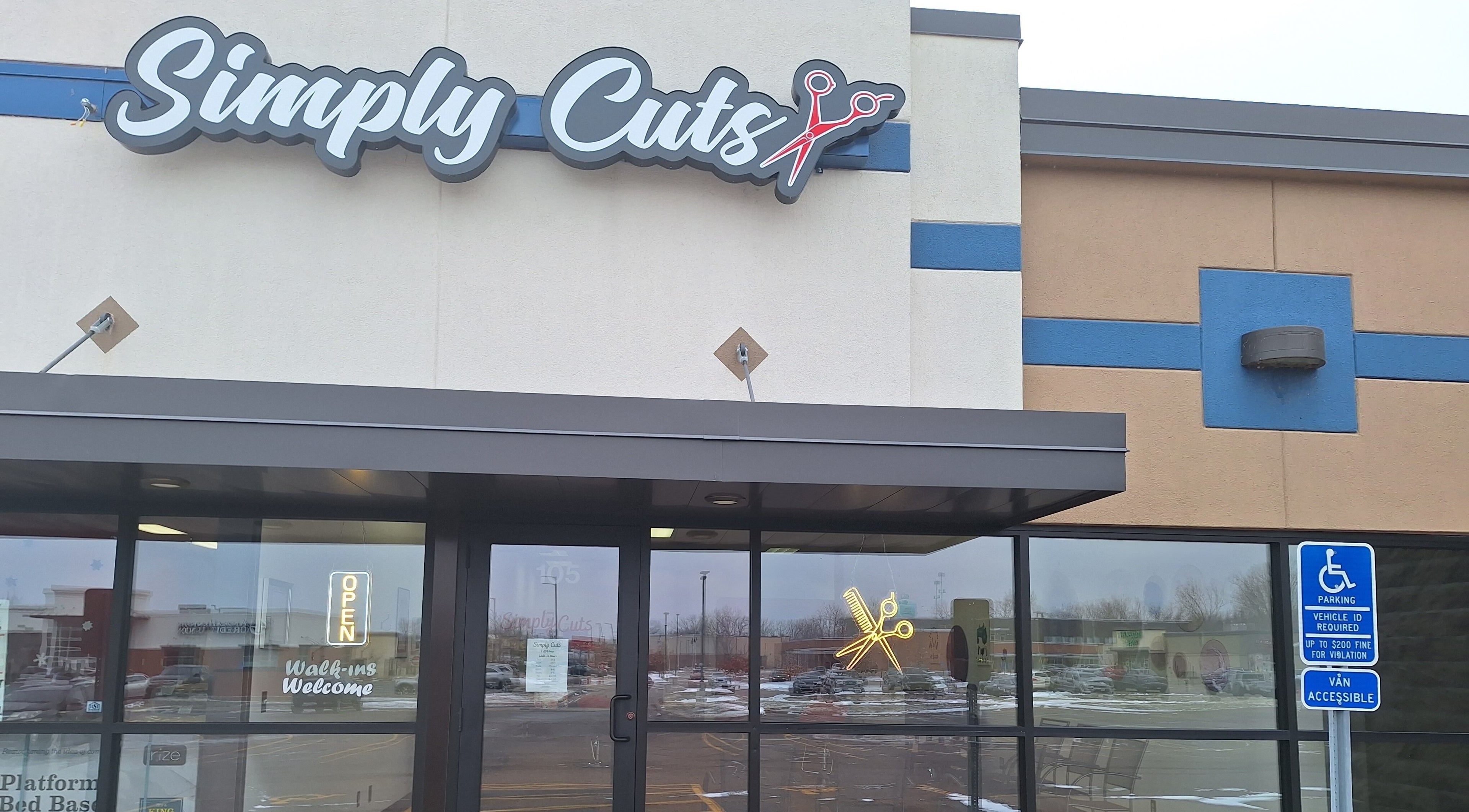 Front view of Simply Cuts salon in Forest Lake, Minnesota, US, showcasing modern entry and logo.