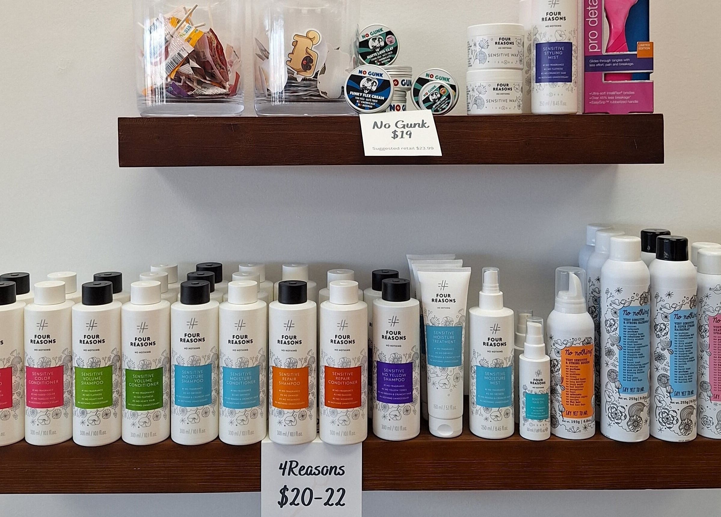 Simply Cuts hair products shelf in Forest Lake, Minnesota, US showcasing various Four Reasons products.