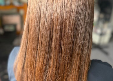 Smooth, shiny hair styled at MariahCharm Simplicity Beauty in Auckland, Auckland, NZ for a sleek look.