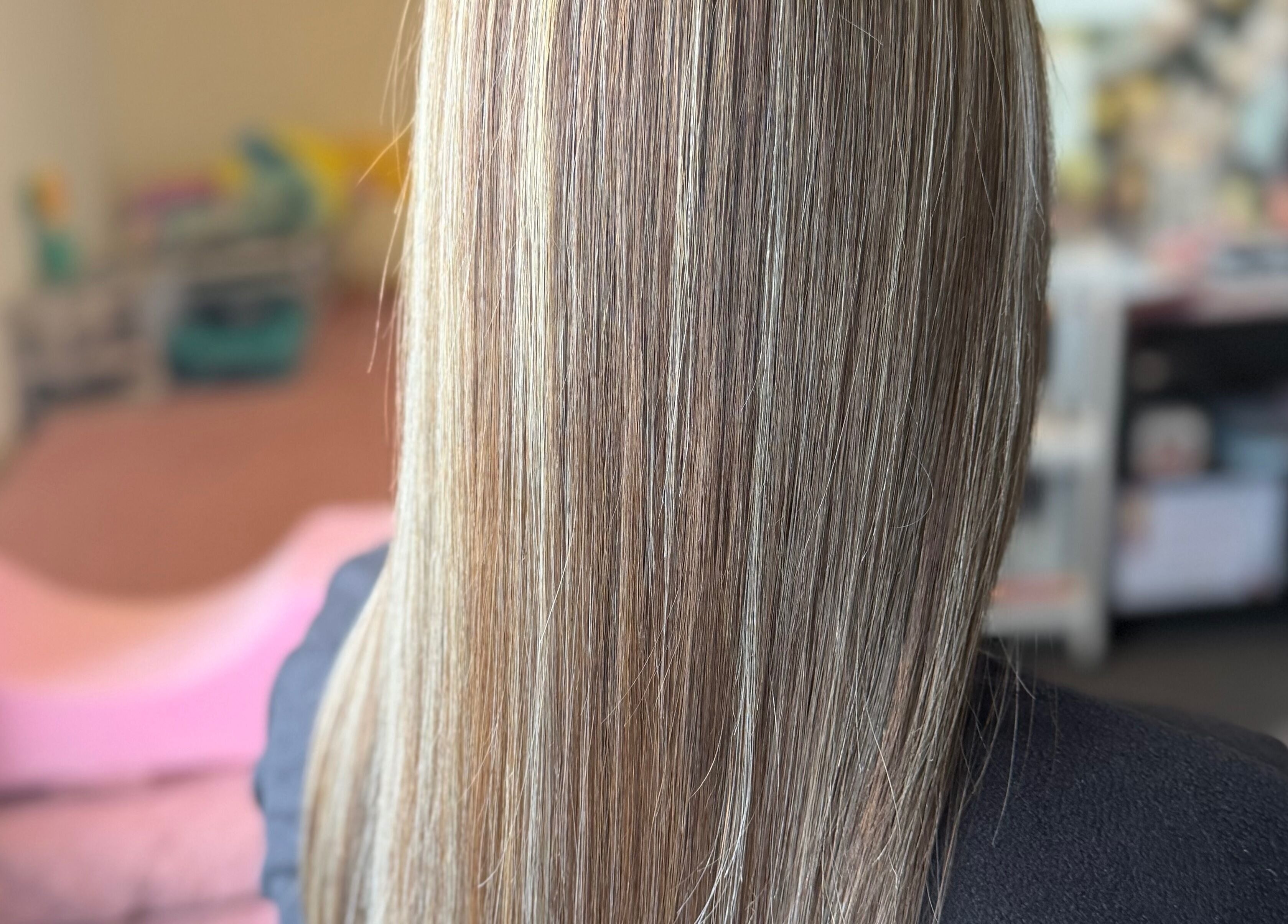 Smooth, straightened hair at MariahCharm Simplicity Beauty, Auckland, NZ showcasing sleek styling services.