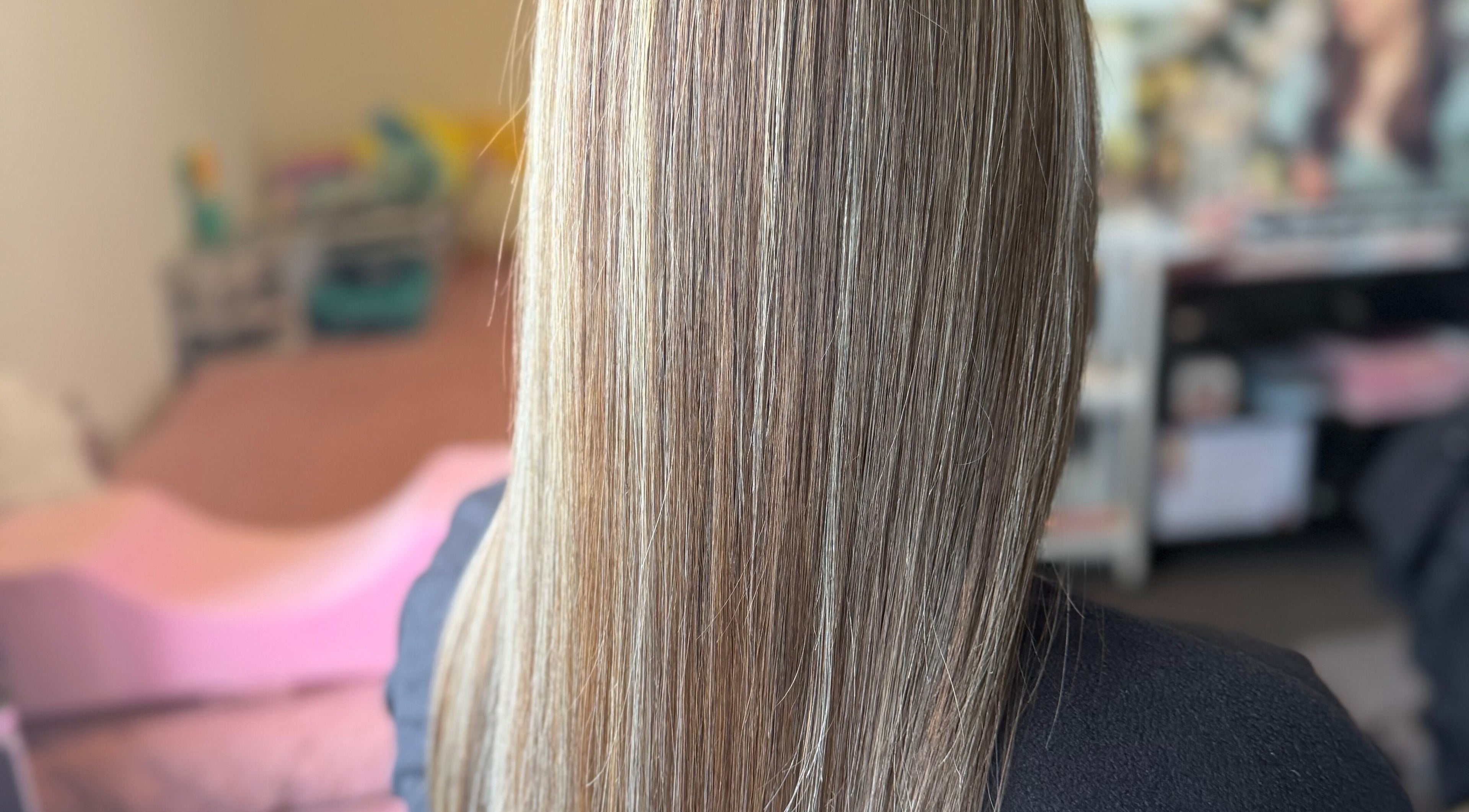 Smooth, straightened hair at MariahCharm Simplicity Beauty, Auckland, NZ showcasing sleek styling services.