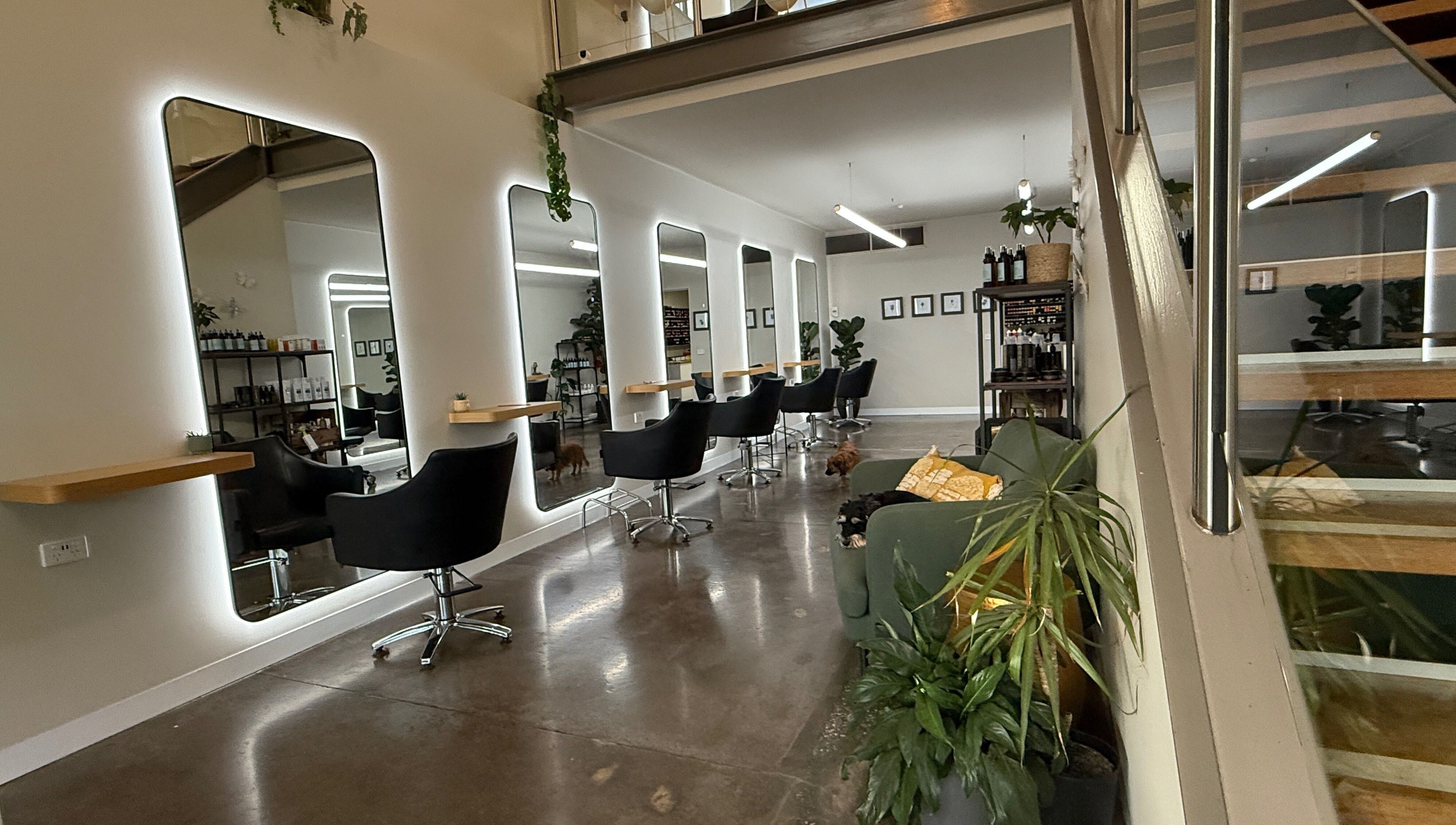 Modern salon interior at Biba Croydon, Melbourne, Victoria, AU, featuring sleek chairs and mirrors.