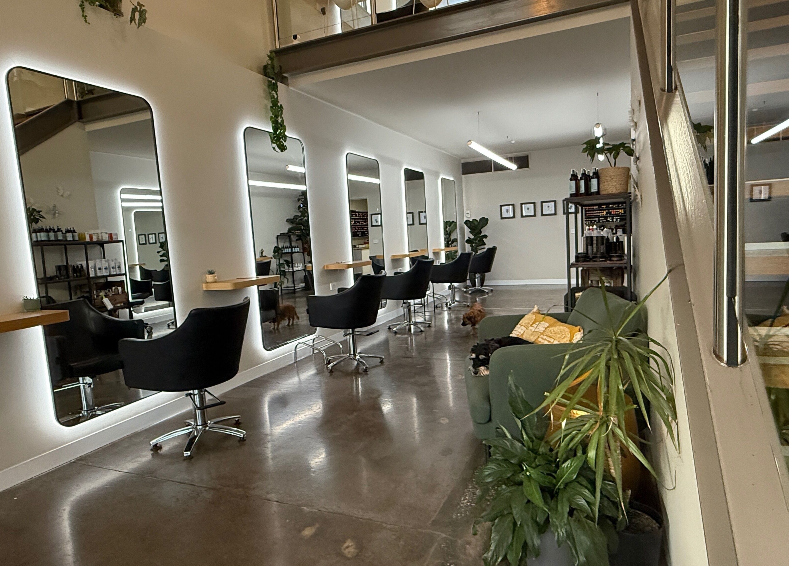 Modern salon interior at Biba Croydon, Melbourne, Victoria, AU, featuring sleek chairs and mirrors.