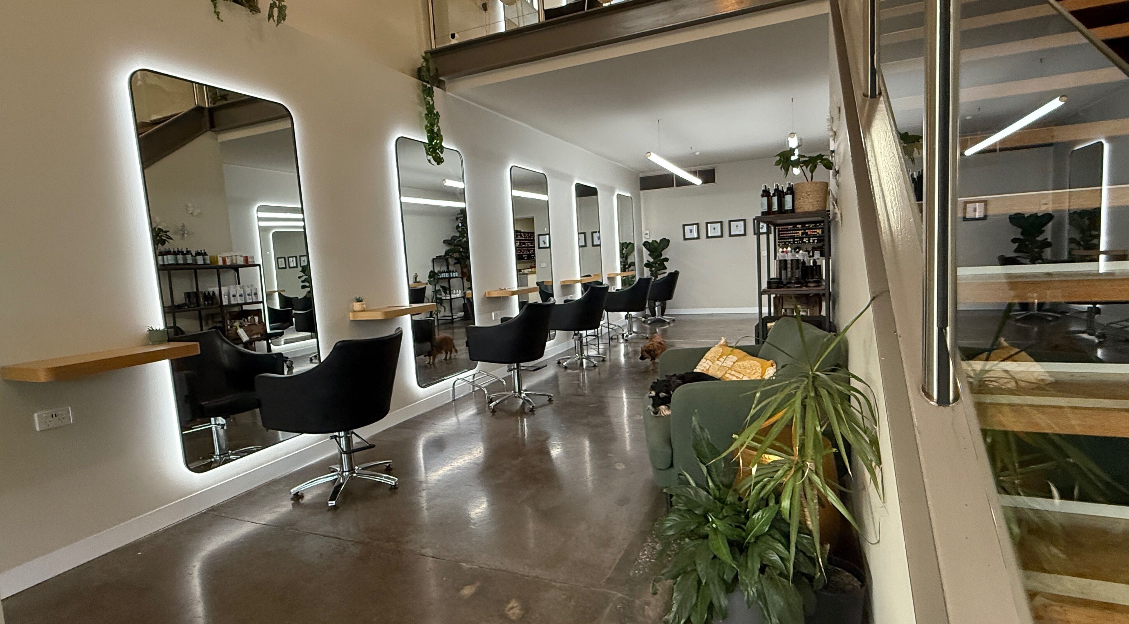 Modern salon interior at Biba Croydon, Melbourne, Victoria, AU, featuring sleek chairs and mirrors.