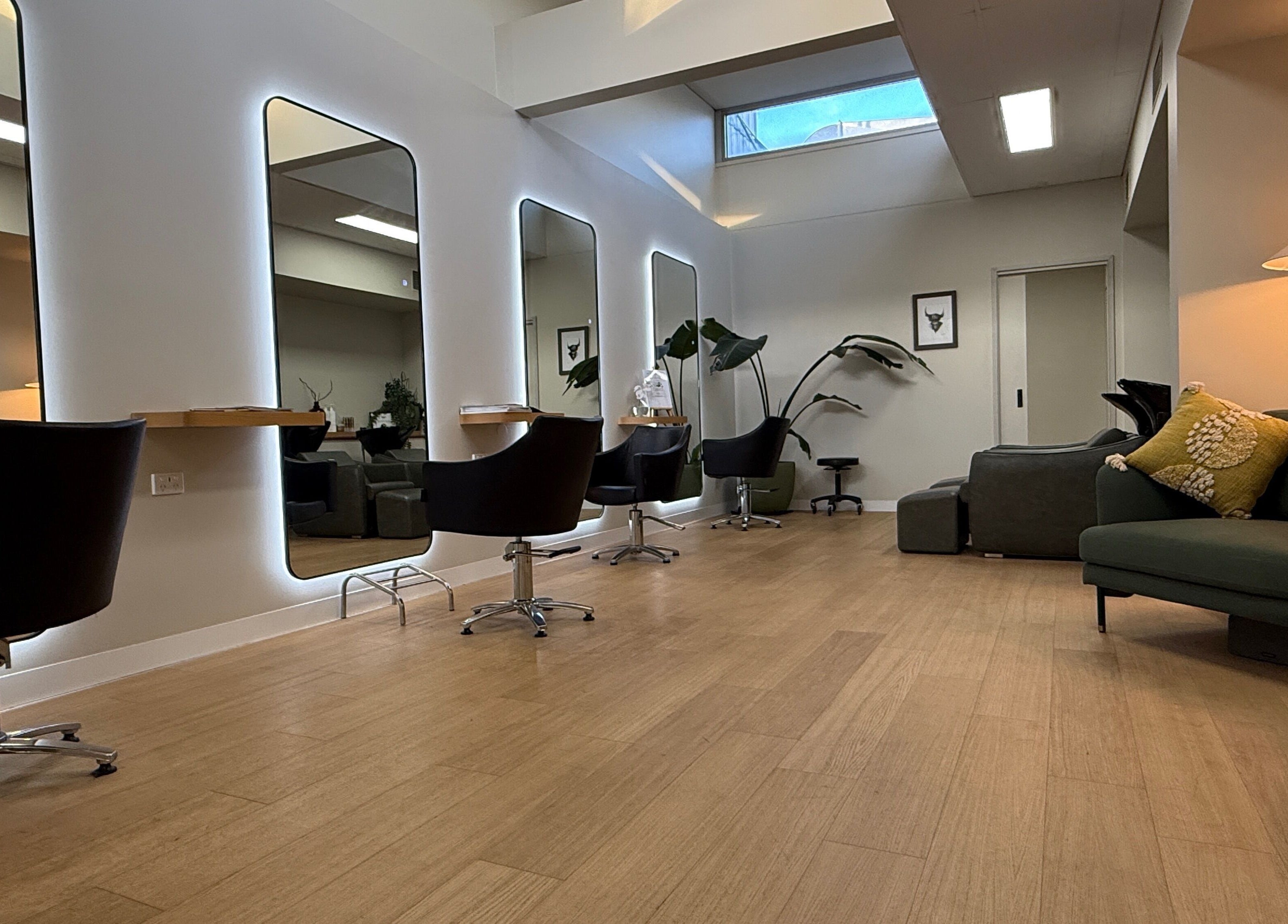 Stylish interior of Biba Croydon salon, Melbourne, Victoria, AU with modern chairs and mirrors.