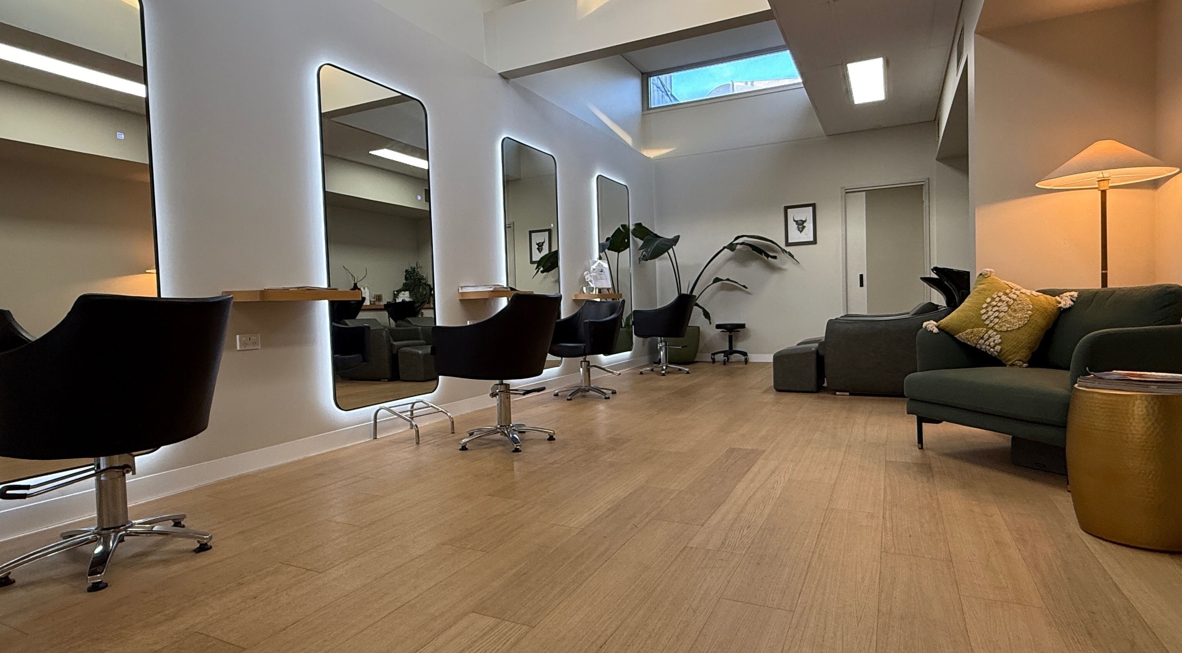 Stylish interior of Biba Croydon salon, Melbourne, Victoria, AU with modern chairs and mirrors.