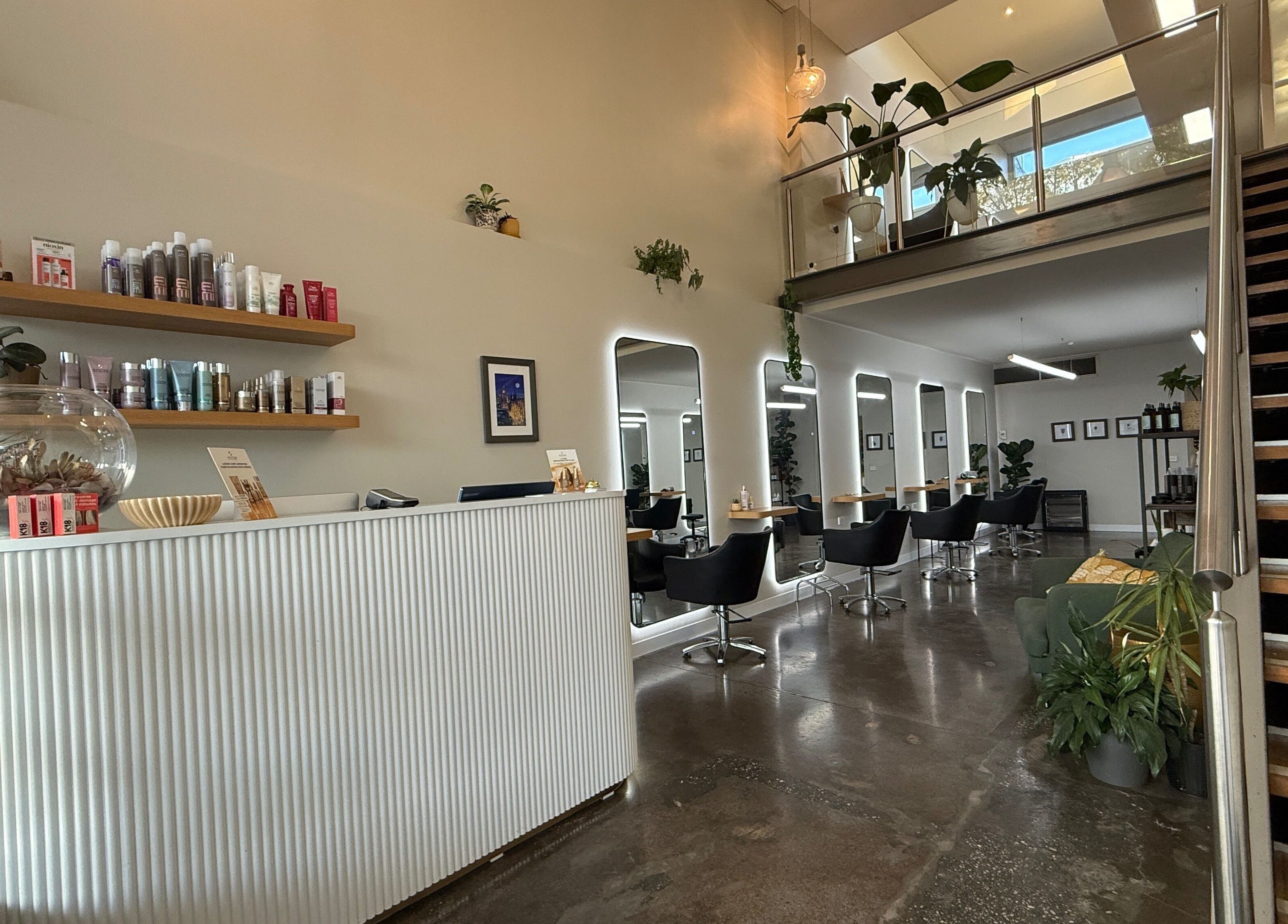 Chic salon interior at Biba Croydon, Melbourne, Victoria, AU, featuring modern decor and styling stations.