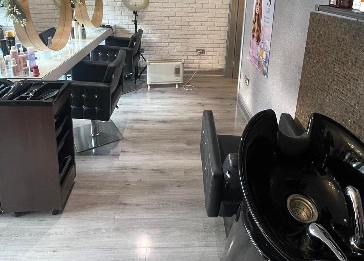 Modern styling area at Spy Salon - North Circular Rd, Dublin, County Dublin, IE with sleek chairs and elegant decor.