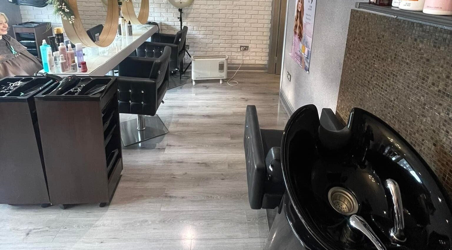 Modern styling area at Spy Salon - North Circular Rd, Dublin, County Dublin, IE with sleek chairs and elegant decor.