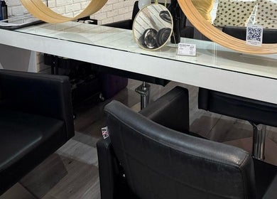 Modern styling station at Spy Salon - North Circular Rd, Dublin, County Dublin, IE featuring chairs and mirrors.