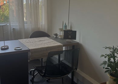 Cozy nail station at Port Studio, Stockport, England with natural light and greenery.
