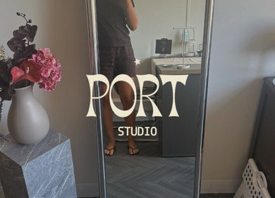 Port Studio mirror display with floral arrangement in Stockport, England, GB.