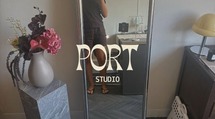 Port Studio mirror display with floral arrangement in Stockport, England, GB.
