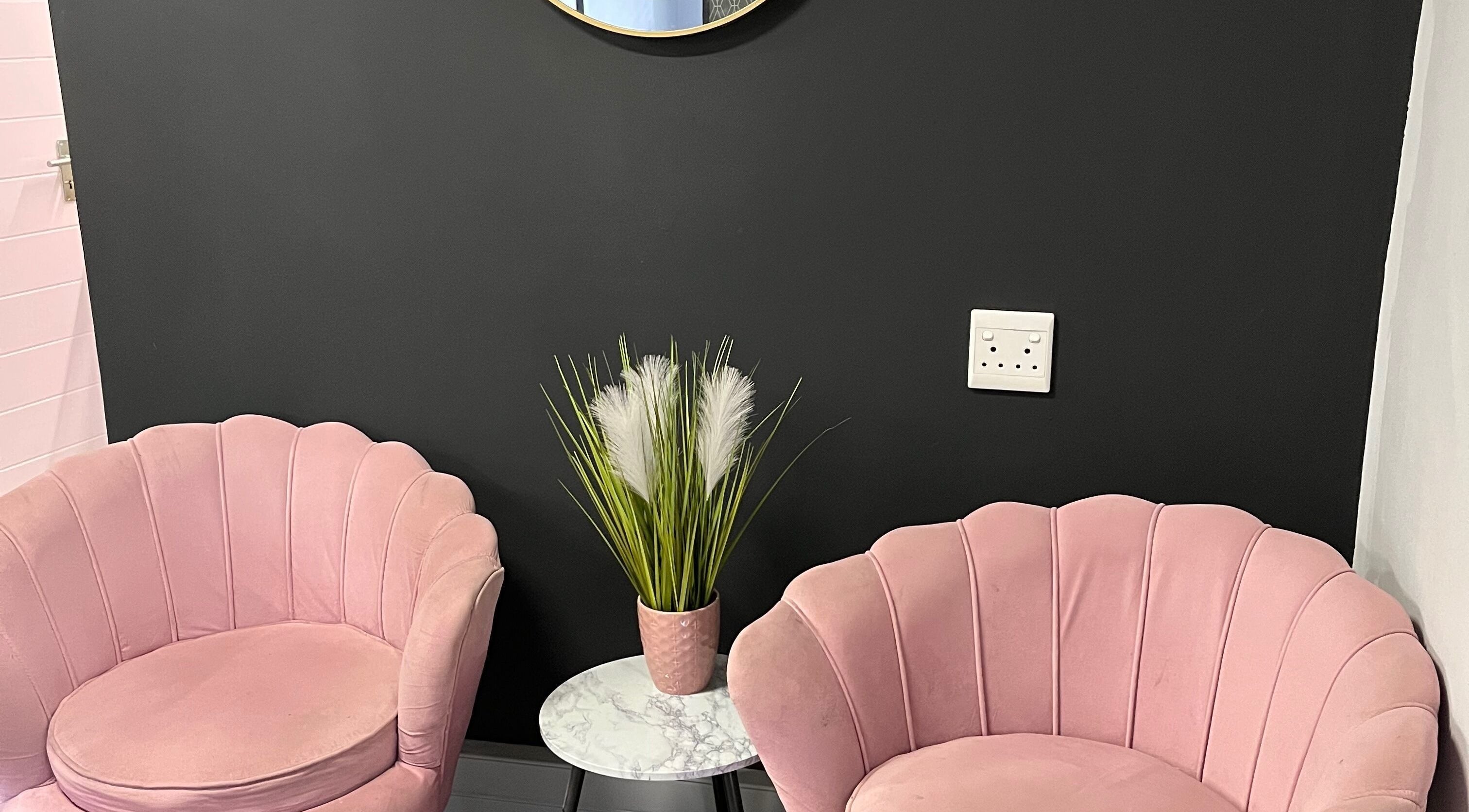 Elegant pink chairs and plant at Arabella Salon, Westville, Kwazulu-natal, ZA create a welcoming ambiance.