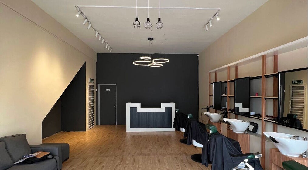 Stylish interior of Manros Hair Studio in Cyberjaya, Selangor, MY with modern decor and seating.