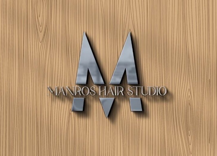 Logo of Manros Hair Studio on wood background, located in Cyberjaya, Selangor, MY.