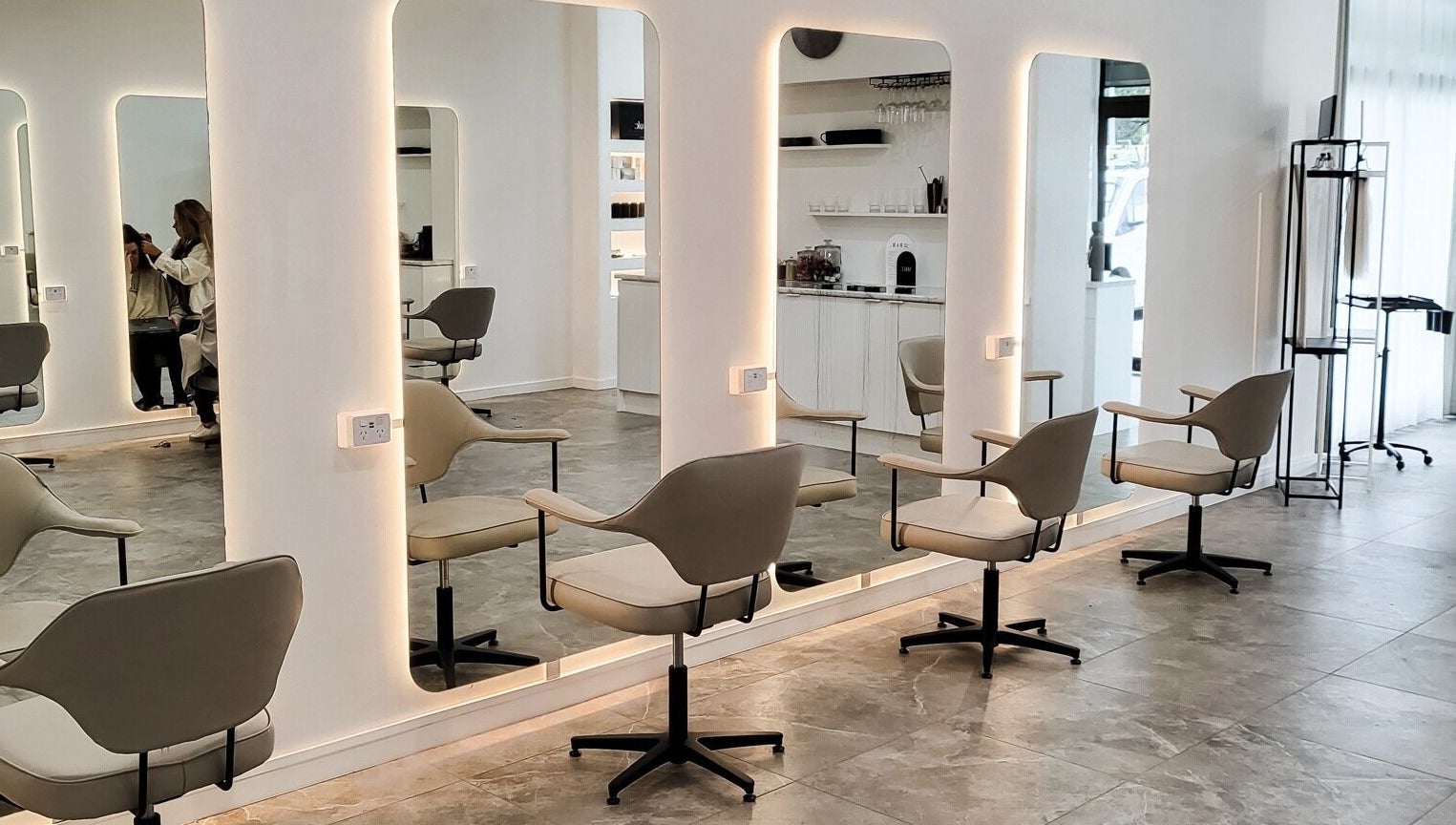 Sleek salon interior at Maiden Hair Extensions, Kilsyth VIC, AU with modern mirrored stations.