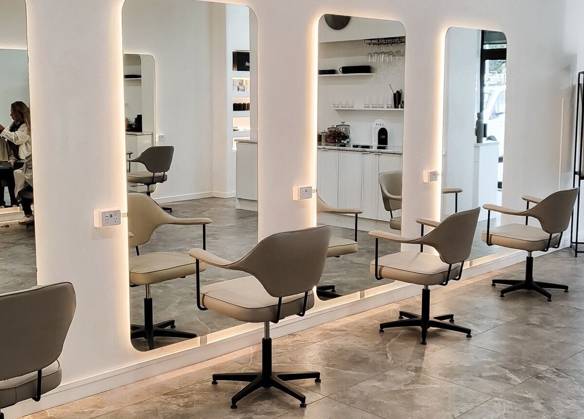 Sleek salon interior at Maiden Hair Extensions, Kilsyth VIC, AU with modern mirrored stations.