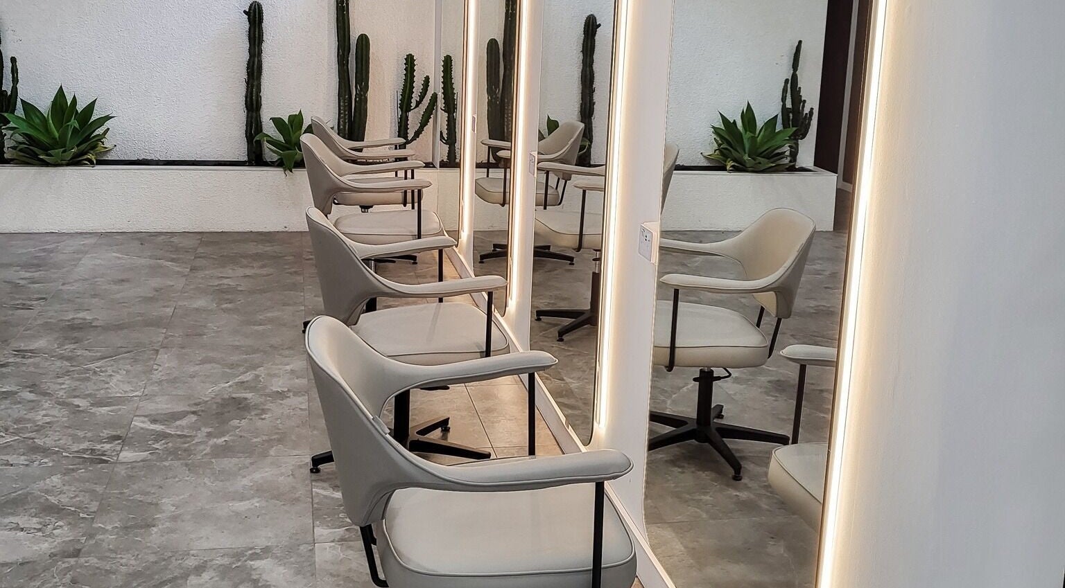 Elegant salon chairs and mirrors at Maiden Hair Extensions, Kilsyth, VIC, AU. A modern beauty space.