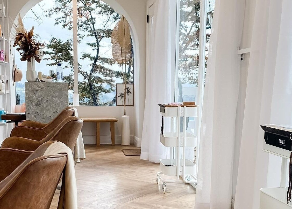Elegant salon interior at Maiden Hair Extensions, Kilsyth, VIC, AU with plush seating and natural light.