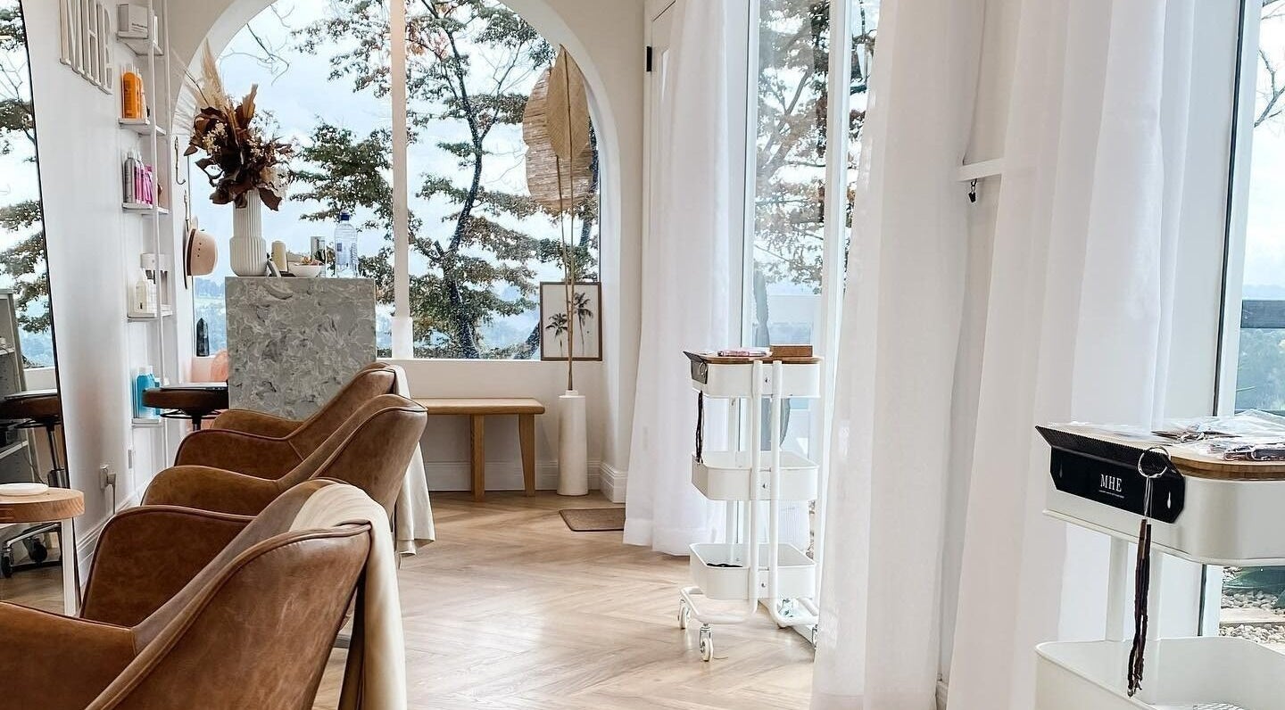 Elegant salon interior at Maiden Hair Extensions, Kilsyth, VIC, AU with plush seating and natural light.